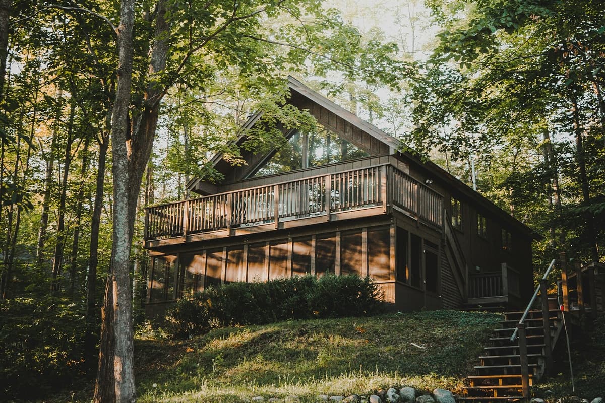 A wood-sided house in a shaded, wooded lot in Marin County