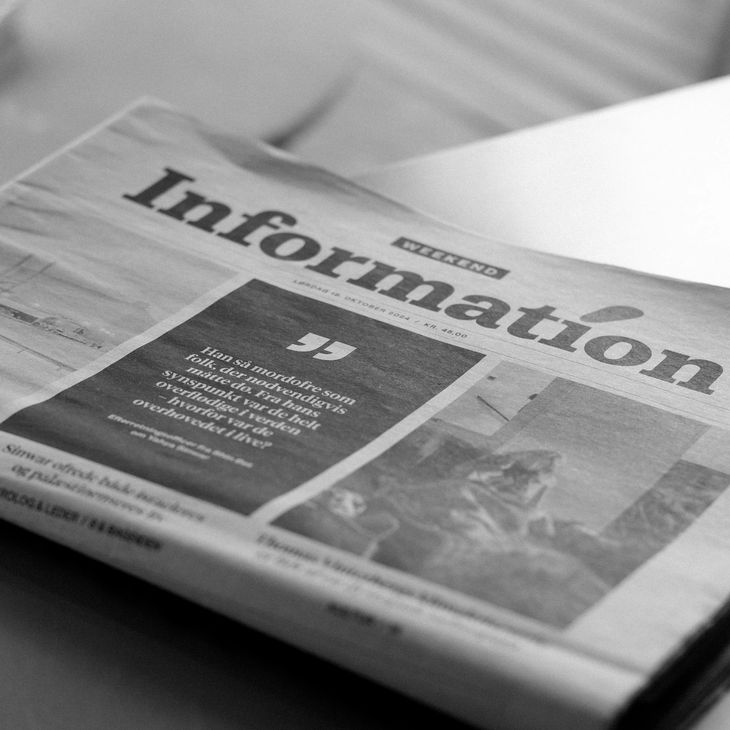 A folded newspaper, representing detailed reporting