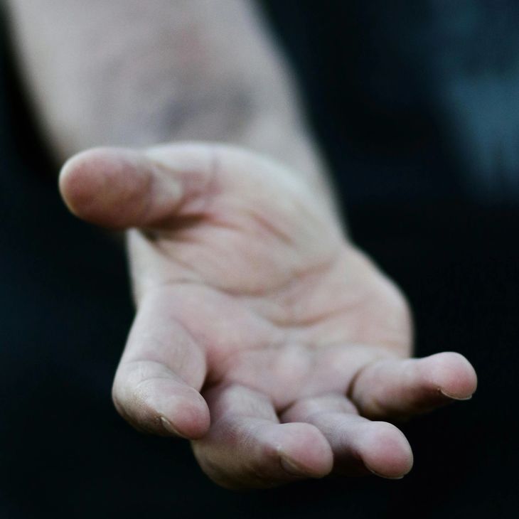 An open hand, representing ongoing support after the inspection